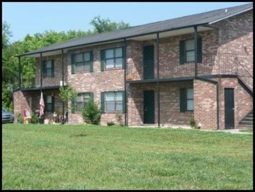 Outdoor photo of a brick housing unit